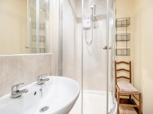 a bathroom with a sink and a shower at The Dairy- Uk45533 in Buildwas