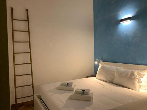 a bedroom with a bed with two candles on it at Navona Rhome in Rome