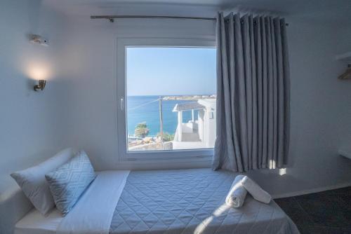 Ένα ή περισσότερα κρεβάτια σε δωμάτιο στο New Paradise Beach Resort - Adults only
