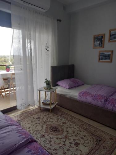 Postel nebo postele na pokoji v ubytování Panoramic apartment