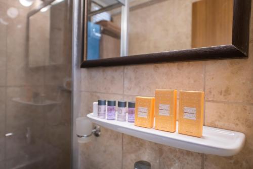 a shelf in a bathroom with books on it at Fethiye Park Hotel in Fethiye