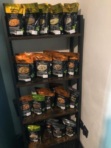 a shelf filled with bags of food at Penzion U Kašpara in Lovosice