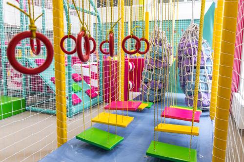 a play room with a bunch of red scissors at MORVA Premium Spa Resort in Yaremche