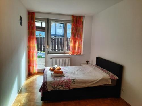 a bedroom with a bed with two teddy bears on it at Apartma Mali grad in Kamnik