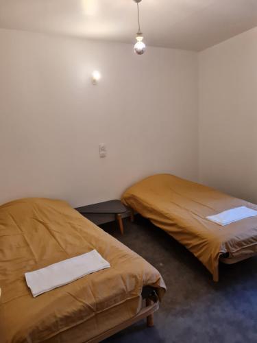 Кровать или кровати в номере maison de ville