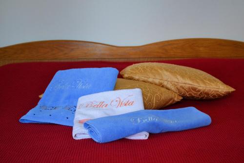a group of pillows sitting on top of a bed at Bella Vista Apartments in Motovun