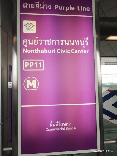 a purple sign on the side of a train at N Condominium in Ban Bang Khen (1)