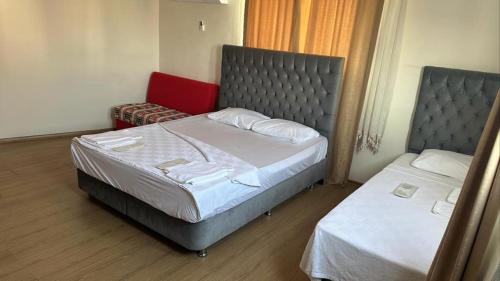 A bed or beds in a room at AQQA RESİDANCE