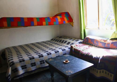 Tempat tidur susun dalam kamar di Refugio Pachalquimia