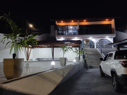 a car parked in front of a house at night at AL EVENTOS in Teresina