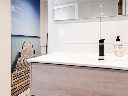 a kitchen with a wooden pier in the background at M&M Studio's 1 & 2 in Zandvoort