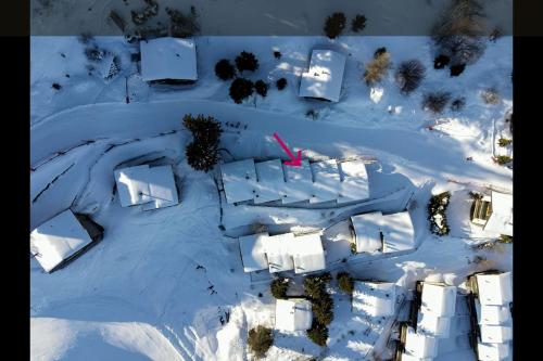 an aerial view of a building in the snow at Chalet Cactus - 4 Vallées in Hérémence
