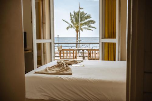 Katil atau katil-katil dalam bilik di Hôtel du Bord de Mer "Le Vanillé"