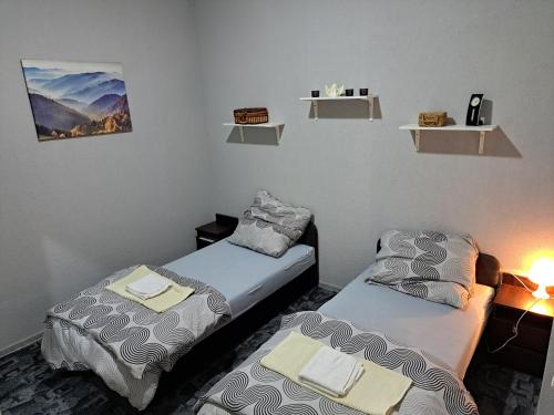 a room with two beds and a lamp in it at Wohnung in Elz in Elz