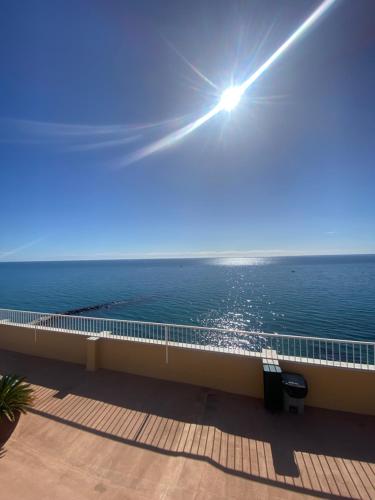 a view of the ocean from the balcony of a building at Marbella Beach Front Edificio Mayoral Centro Ciudad y Primera Línea Playa Muy Amplio y Espacioso in Marbella