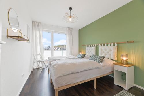 Postel nebo postele na pokoji v ubytování Design-Apartment - Küche - Dachterrasse - zentral