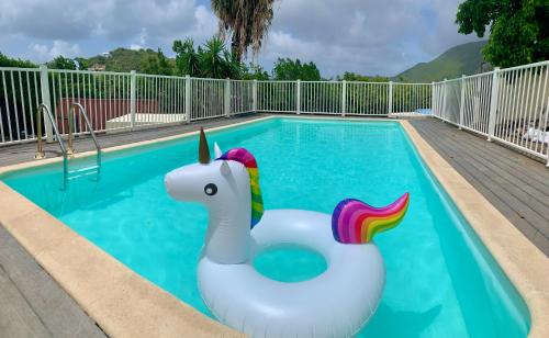 a pool with a unicorn float in the middle at Happy Friar's in Friar's Bay