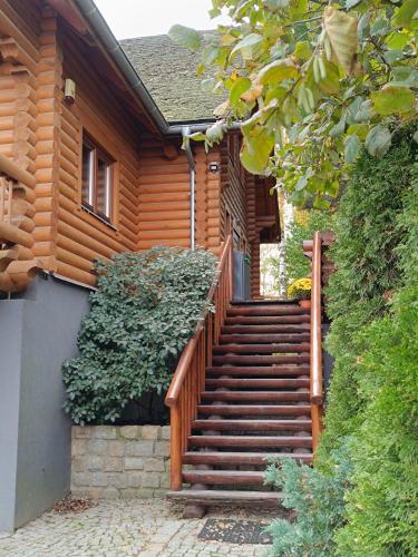 a wooden staircase leading up to a house at Wilcza Przystań in Borzygniew