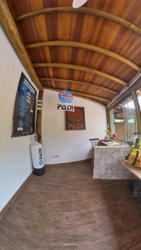 a room with a raid sign on a wall at Diver Village Ilhabela in Ilhabela
