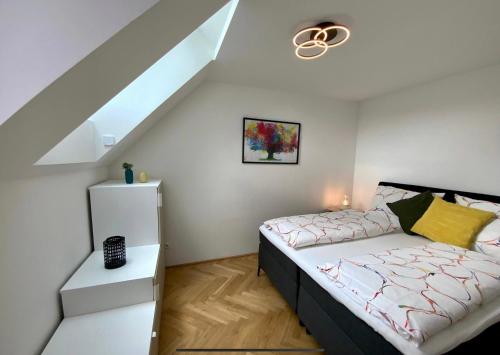 a bedroom with a bed and a staircase at Freshly renovated Apartment in Trendy Area! HG21 in Vienna