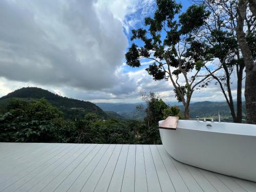 a white bath tub sitting on top of a roof at Arabica Lodge (อาราบิก้า ลอดจ์) in Ban Huai Khai