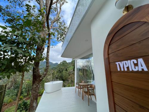a pivot door in a house with a view at Arabica Lodge (อาราบิก้า ลอดจ์) in Ban Huai Khai