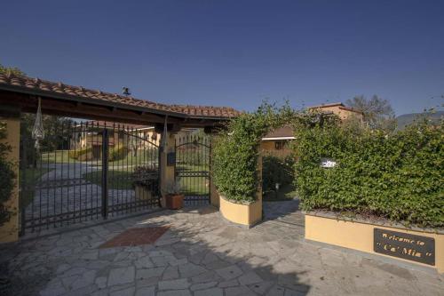 an entrance to a building with a fence and plants at CàMia Lovely house ValDiVara 5Terre hiking in Sesta Godano