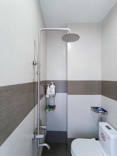 a bathroom with a toilet and a shower at MyTran Homestay-HauLoan in Quy Nhon
