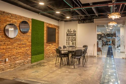 a dining room with a table and chairs at Hotel Wess in Bogotá