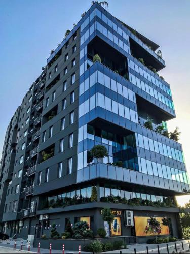 a tall building with a lot of windows at Sunlight Luxe Apartment in Skopje