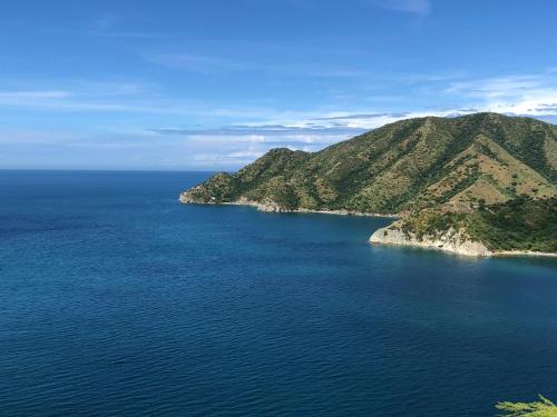 an island in the middle of a large body of water at Cabañas Annapurna in Taganga