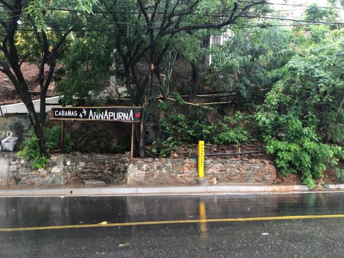 a street sign on the side of a road at Cabañas Annapurna in Taganga