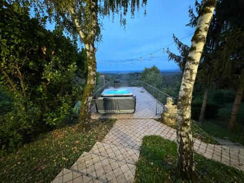 a house with a swimming pool on a patio at Vlaškovec Experience in Plešivica
