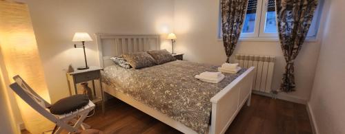 Una cama o camas en una habitación de Paraiso Zlatibor