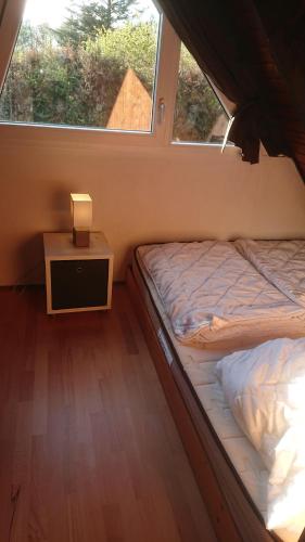a small bedroom with a bed and a window at Ferienhaus-Freilingen in Blankenheim
