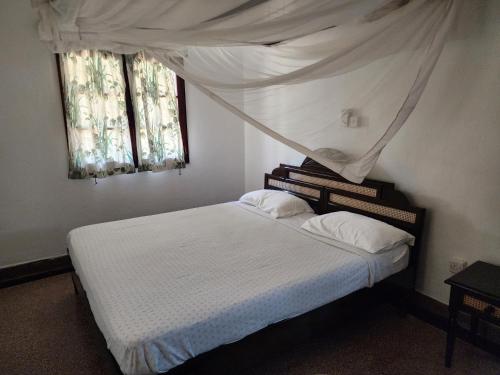 Llit o llits en una habitació de Villa 107 - Karibuni Villas Mambrui, Malindi