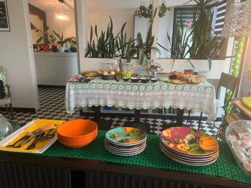 a table with plates of food on top of it at Seven boutique hotel in Sestri Levante