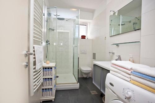 a bathroom with a shower and a toilet at Apartment Miaa in Split
