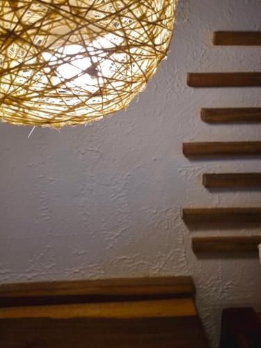 a chandelier hanging from a ceiling in a room at Kankui Lodge in El Zaino