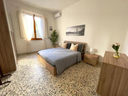 a bedroom with a bed and a television in it at Appartamento Stella in Empoli