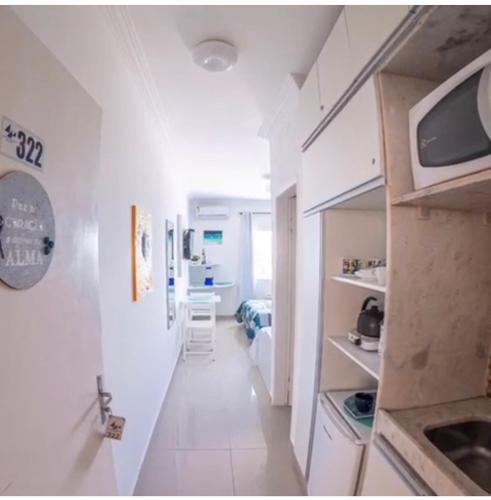 Ένα ή περισσότερα κρεβάτια σε δωμάτιο στο Flat no Apart Hotel Marinas beira mar