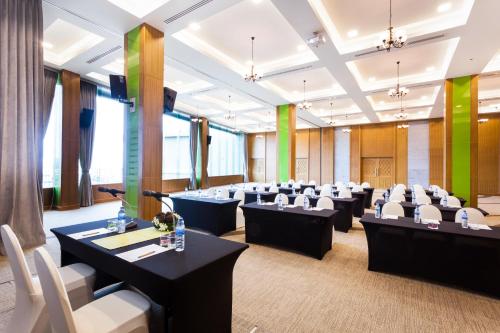 a conference room with tables and chairs in it at The Senses Resort & Pool Villas, PHUKET in Patong Beach