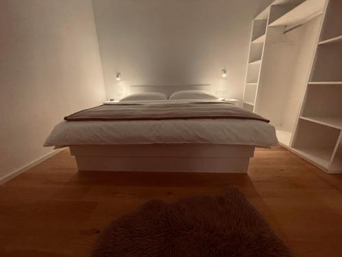 Ein Bett oder Betten in einem Zimmer der Unterkunft Die Bludenzerin