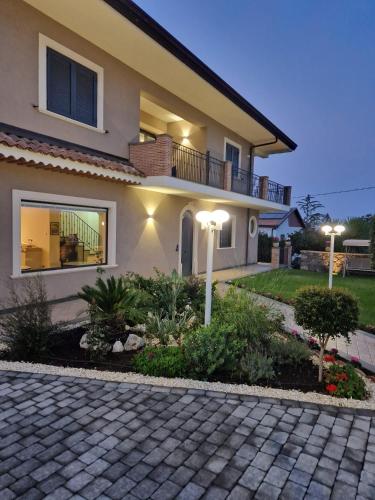 a house with two lights on a driveway at Bedda Mia Etna House B&B in Trecastagni