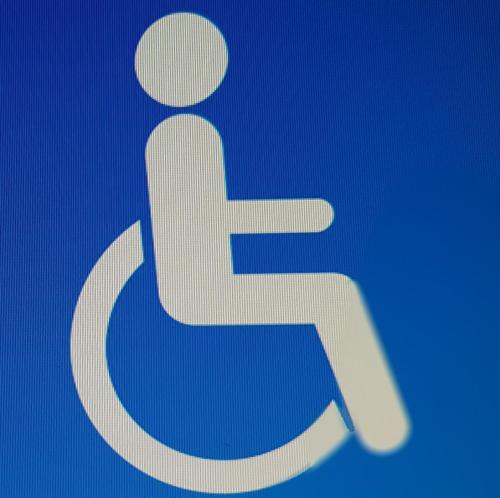 a blue sign with a man sitting on a toilet at Petite maison au bord du canal, 8' Zoo de Beauval, PMR in Noyers-sur-Cher