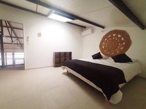 Ένα ή περισσότερα κρεβάτια σε δωμάτιο στο Loft 5 Montélimar