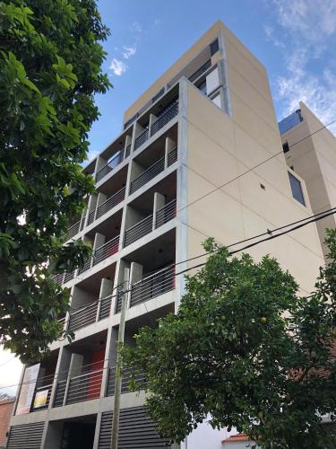 an apartment building with balconies on the side of it at 2 Personas - Balcon, Wifi & Cafe in Santiago del Estero