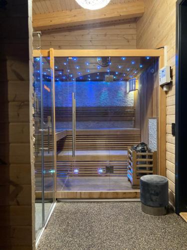 a room with a large glass door with a window at Blockhaus Kik im Harz in Sankt Andreasberg