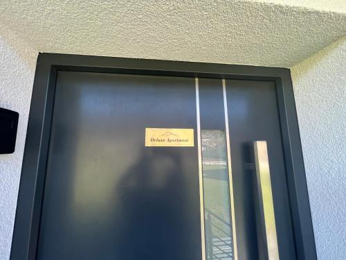 a sign on the door of a building at Alpin Apartments in Radstadt