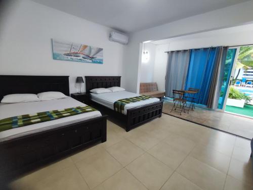 Katil atau katil-katil dalam bilik di Villas Playa Blanca